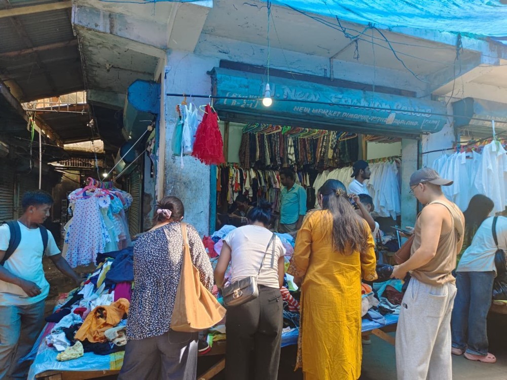 Shoppers browse through second-hand clothing at a thrift store in New Market, Dimapur. Once driven largely by affordability, thrifting is increasingly becoming a way for many young people in Nagaland to express their personal style. (Photo by Surotsa Anar)